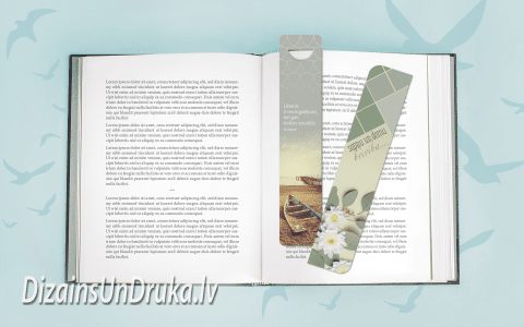 Open book with text and two design bookmarks on a light blue background